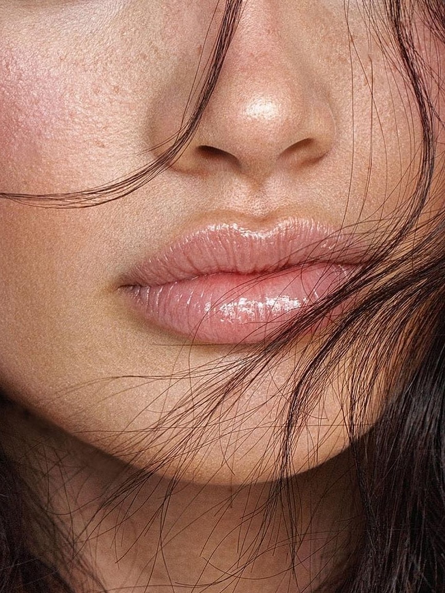 Close-up of lips and facial skin texture.